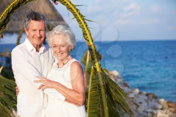 Senior Couple Getting Married In Beach Ceremony