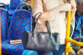 Passenger Leaving Change Purse On Seat Of Bus