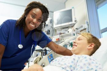 Boy Talking To Female Nurse In Emergency Room
