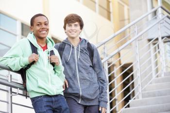 Two Male High School Students Standing Outside Building