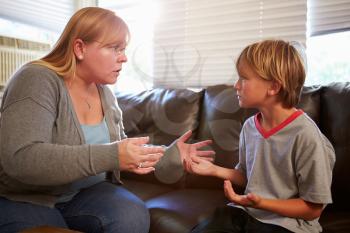 Mother Telling Off Son At Home