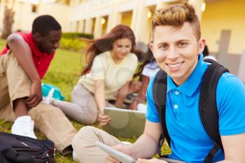 High School Students Studying Outdoors On Campus