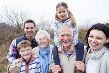 Portrait Of Multi Generation Family On Countryside Walk