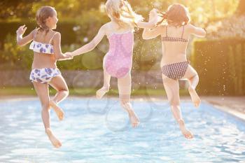 Group Of Girls Playing In Outdoor Swimming Pool