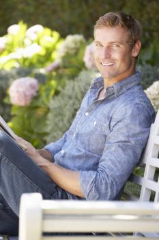 Man reading in garden