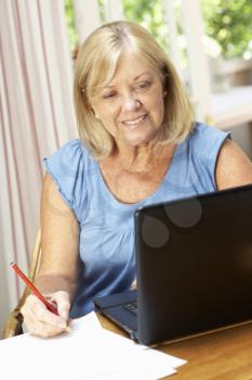 Senior Woman Working In Home Office