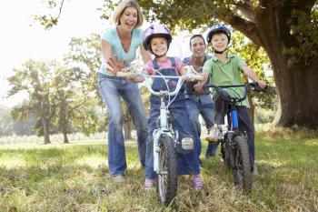Parents with young children on bikes