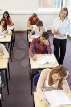 Students and tutor in exam