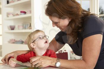 Downs Syndrome boyhaving speech therapy