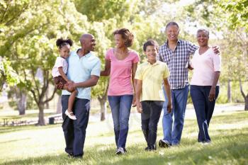 Multi-generation  family walking in park