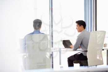 Two people working in a modern office
