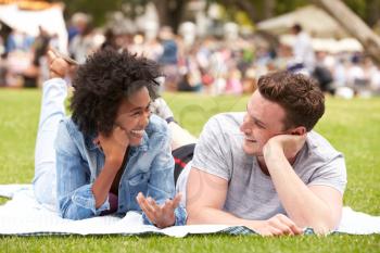 Couple Relaxing At Outdoor Summer Event