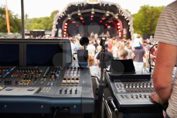 Sound and lighting desk at an outdoor festival concert