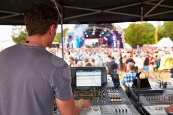 Sound and lighting engineer at an outdoor festival concert