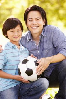 Father and son with football
