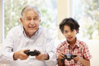 Grandfather and grandson playing computer games