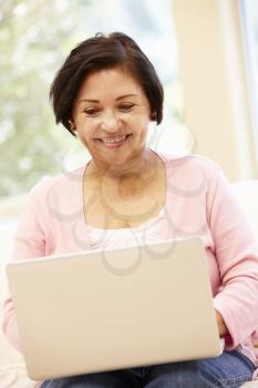 Senior Hispanic woman with laptop