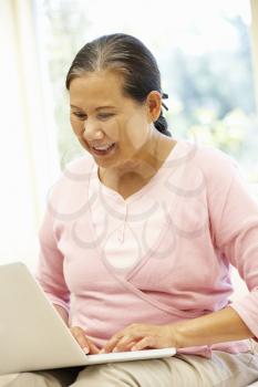 Senior Asian woman using laptop