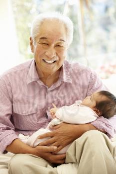Asian man and baby granddaughter