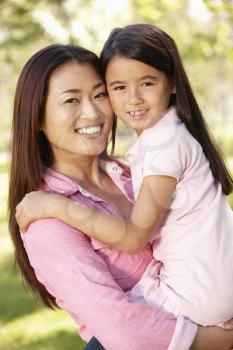 Portrait Asian mother and daughter outdoors