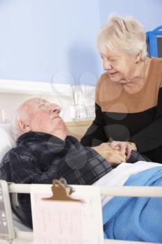 Senior woman visiting husband in hospital