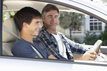 Father Teaching Teenage Son To Drive