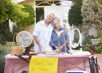Senior Couple Holding Yard Sale
