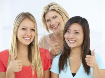 Group Of Happy And Positive Businesswomen In Casual Dress Making Thumbs Up Gesture