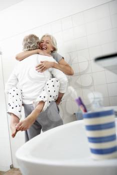 Romantic Senior Couple In Bathroom