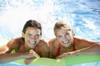 Two Women On Holiday In Swimming Pool