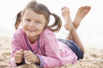 Young Girl Relaxing On Beach