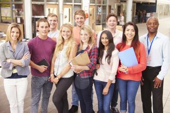 Group Portrait Of College Students With Tutor