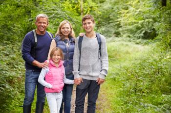 Portrait Of Family On Walk Through Beautiful Countryside