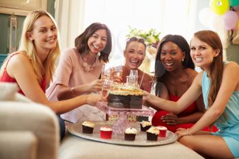 Portrait Of Female Friends Celebrating Birthday At Home