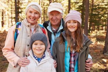 Portrait of kids and grandparents in forest