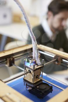 Close Up Of 3D Printer Operating In Design Studio