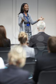 Businesswoman Making Presentation At Conference