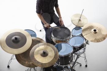 Overhead Shot Of Drummer Playing Drum Kit In Studio