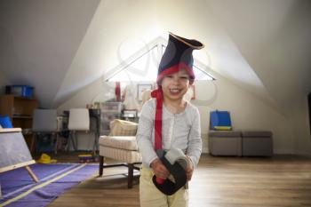 Portrait Of Boy Dressing Up As Pirate In Playroom
