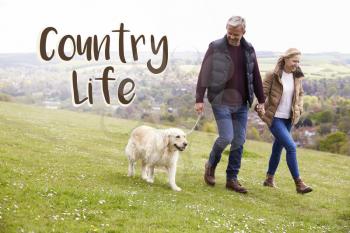 Country Life Couple Taking Dog For Walk