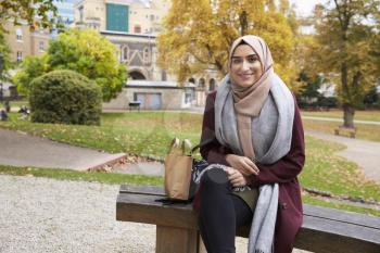 Portrait Of British Muslim Woman On Lunch Break In Park