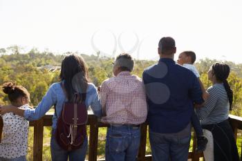 Multi Generation Family Standing On Outdoor Observation Deck