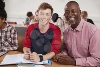 College Student Has Individual Tuition From Teacher In Classroom