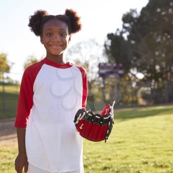 Young Black girl with baseball mitt, smiling, square format