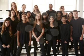 Portrait Of Male And Female Students Singing In Choir At Performing Arts School