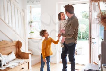 Single Father Returning Home After Trip Out With Excited Children Running Ahead