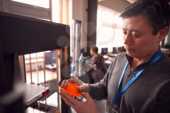 Mature Male College Student Studying Engineering Using 3D Printing Machine