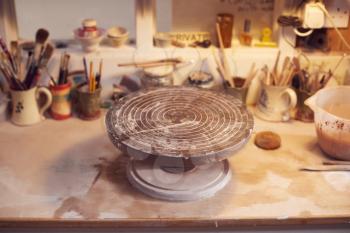 Turntable For Decorating Handmade Pottery On Workbench In Ceramics Studio