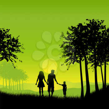 Silhouette of a family out walking 