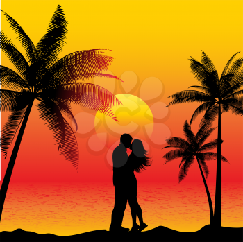 Silhouette of a couple kissing on a beach at sunset